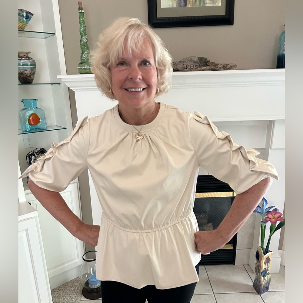 Voy faux leather top in size M. Cream color, ruffled sleeves.